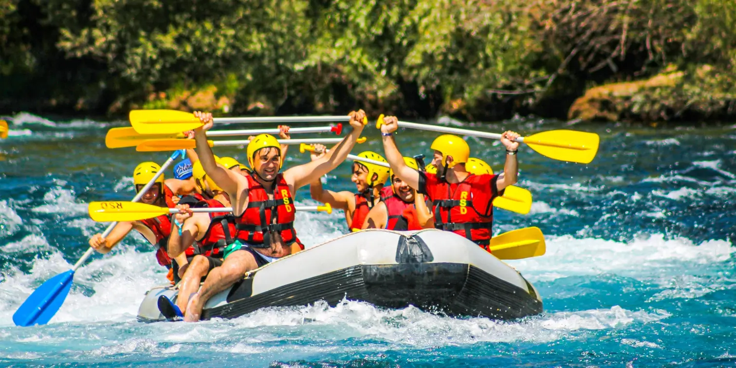 People Riding on Inflatable Raft