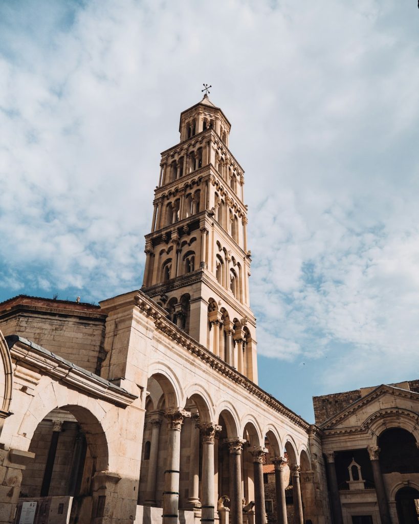 The bell tower of the Cathedral of St Domnius rising above the rooftops of Diocletian's Palace in Split, Croatia
